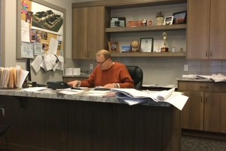 Gordon Skene at Work on a Custom Design Gordon Skene working at his desk on a custom home design project